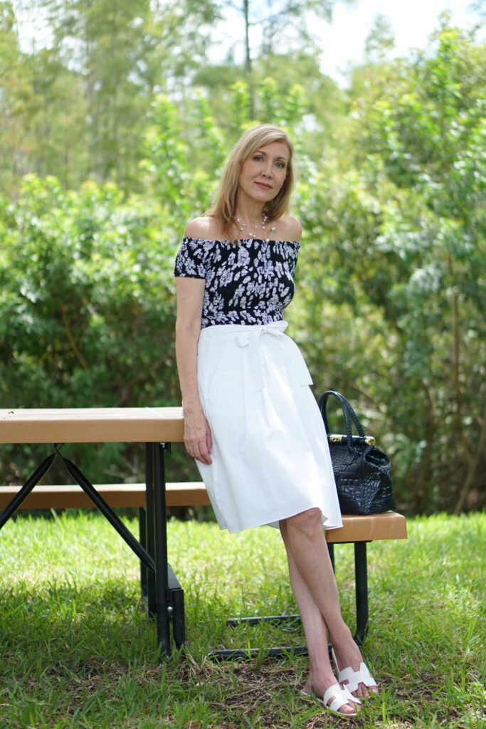 Sharing a Journey fashion wearing white skirt and black floral top