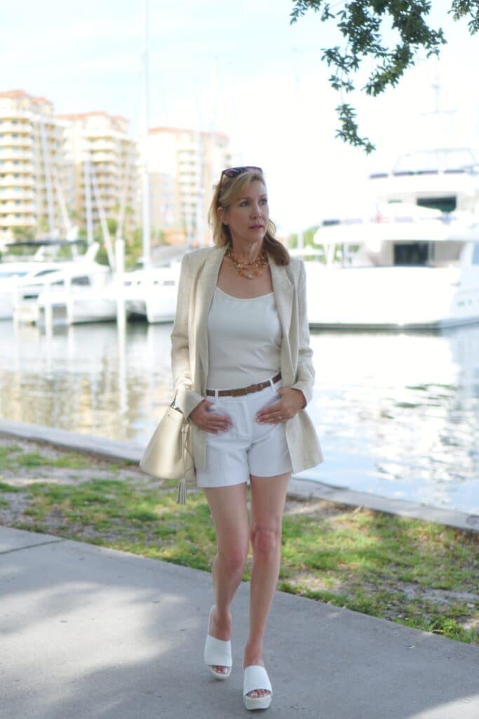 Nina from Sharing A Journey waring white shorts and blazer