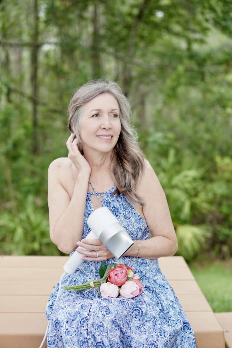 Nina Anders holding Zuvi Halo Hair dryer