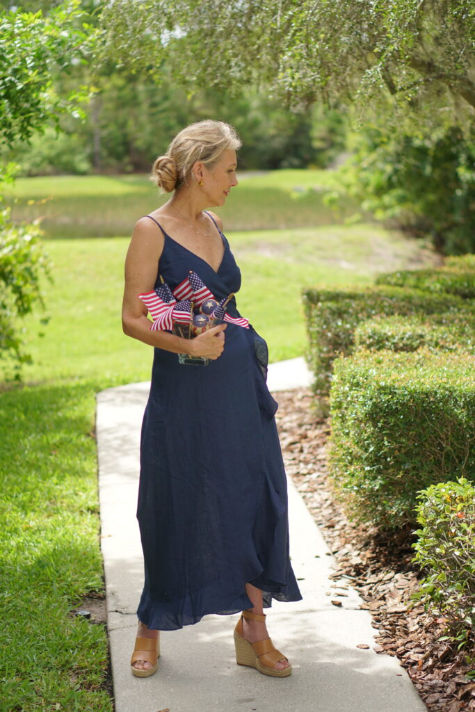 Nina Anders from Sharing A Journey Blog wearing Navy wrap dress, Stylish women over 50.