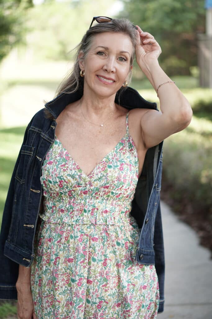 Nina Anders, over 50 fashionista wears denim jacket and Liberty Print/JCrew summer dress