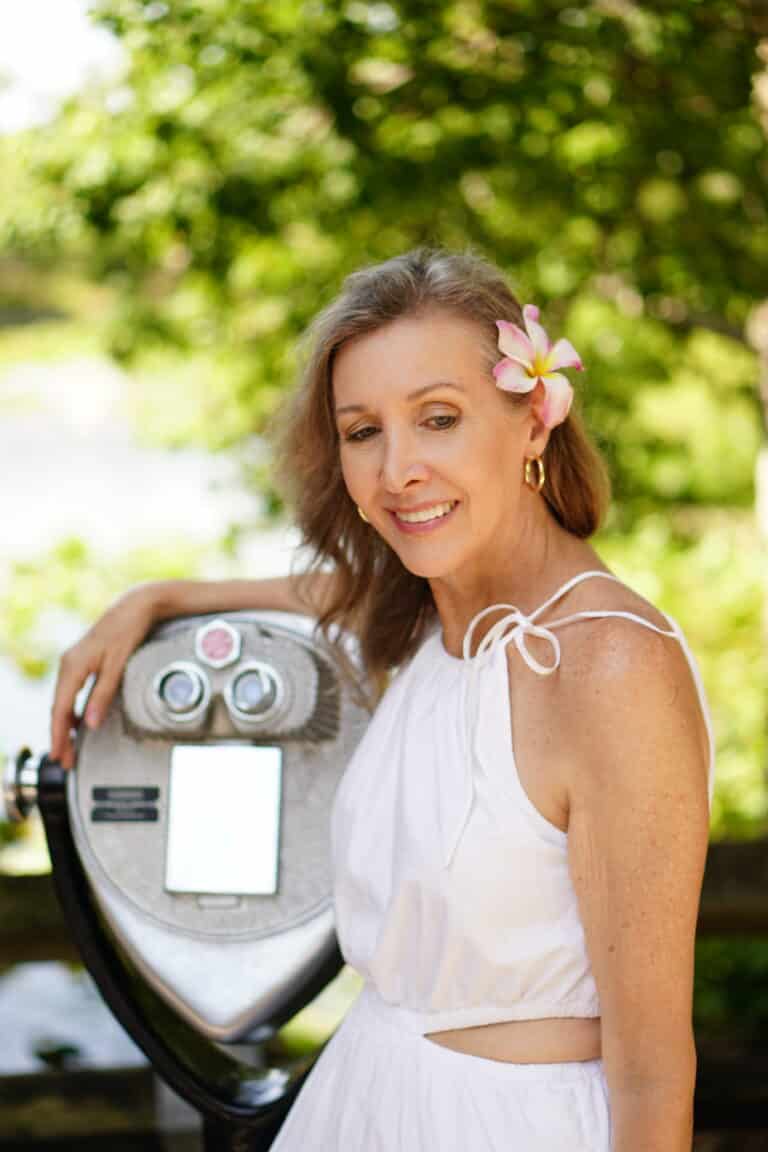 Nina Anders over 50 influencer wears white sundress